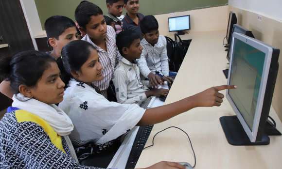 Children learning at the computer training centre